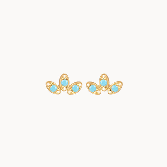 Petites boucles d'oreilles clous fleur trois pétales zircons turquoises
