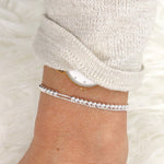 il y a un bracelet double chaine box associé à des perles rondes en argent 925 pour femme